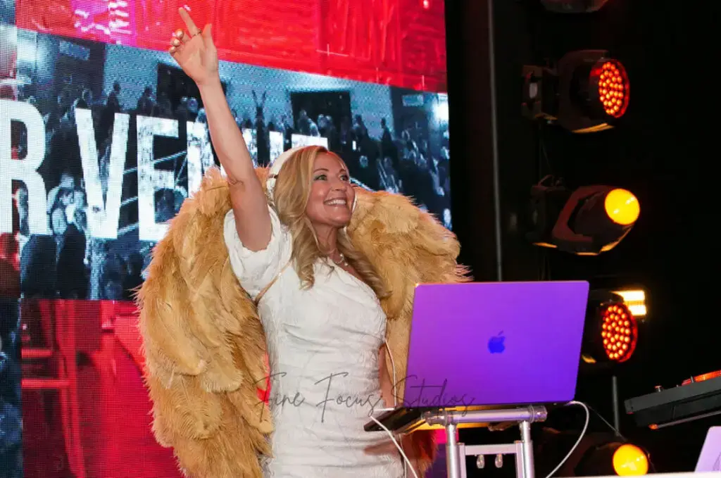 Blonde Female DJ DeeJay Shelly wearing her gold wings